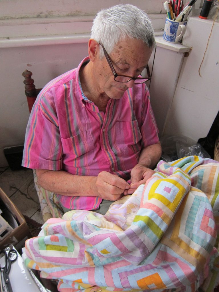 Kaffe Fassett working on a quilt