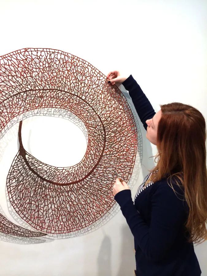 Meredith installing Scribbly Gum Leaf at Tamworth Regional gallery